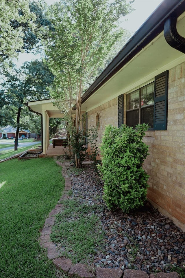 130 Golfcrest St, Rusk, TX 75785 - view of property exterior with brick siding and a lawn