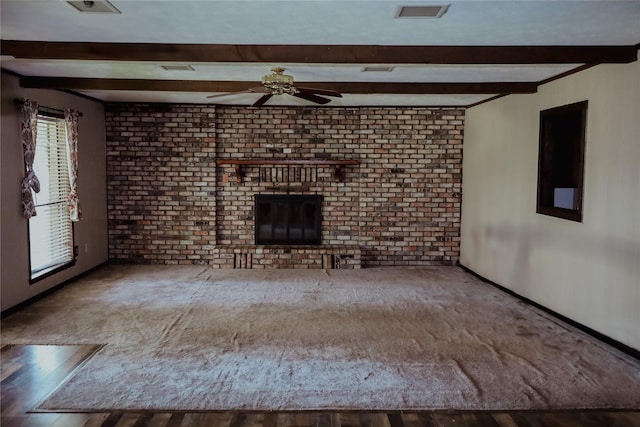 130 Golfcrest St, Rusk, TX 75785 - unfurnished living room featuring beam ceiling, ceiling fan, and wood finished floors