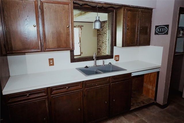 130 Golfcrest St, Rusk, TX 75785 - kitchen with dishwashing machine, light countertops, dark brown cabinets, and decorative light fixtures