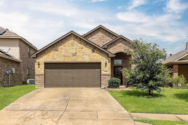 5365 Saba Dr, Fort Worth, TX 76119 - french country home with brick siding, a garage, and a front lawn