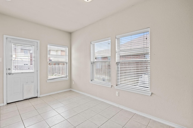 5365 Saba Dr, Fort Worth, TX 76119 - empty room featuring healthy amount of natural light and light tile patterned flooring