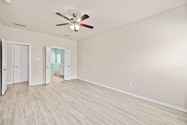 5365 Saba Dr, Fort Worth, TX 76119 - unfurnished bedroom with light wood-style flooring, connected bathroom, and a ceiling fan