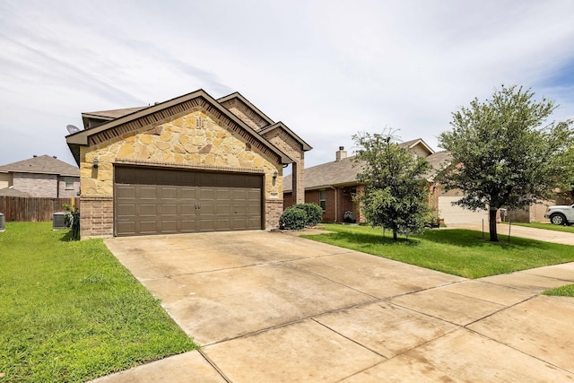 5365 Saba Dr, Fort Worth, TX 76119 - view of front of house with brick siding, concrete driveway, a garage, and stone siding