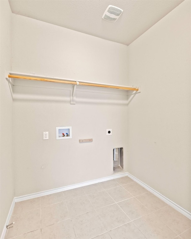 5365 Saba Dr, Fort Worth, TX 76119 - washroom with hookup for a washing machine, light tile patterned floors, and electric dryer hookup