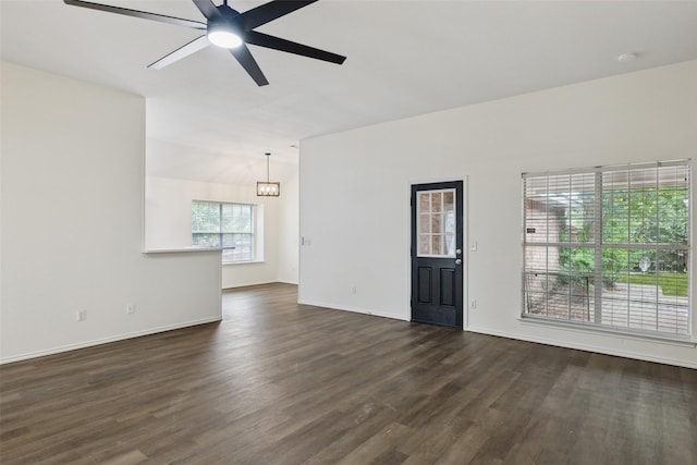 9942 Laurel Ln, Frisco, TX 75035 - unfurnished living room with ceiling fan, dark wood-style flooring, and a chandelier