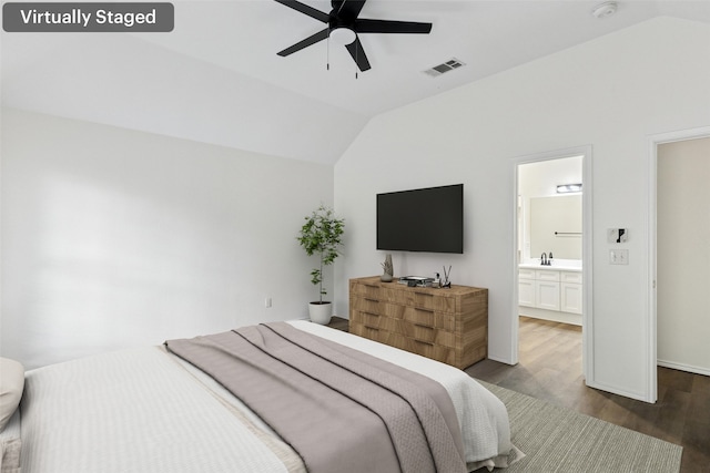 9942 Laurel Ln, Frisco, TX 75035 - bedroom featuring vaulted ceiling, wood finished floors, ensuite bath, and a ceiling fan