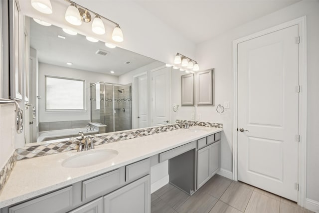 3516 Hathaway Ct, Irving, TX 75062 - bathroom featuring a shower stall, double vanity, and a garden tub