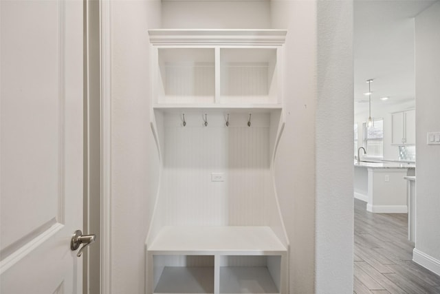 3516 Hathaway Ct, Irving, TX 75062 - mudroom featuring wood finished floors and baseboards