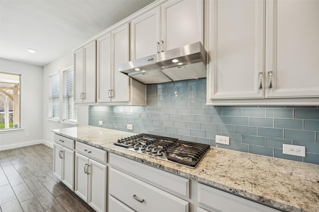 3516 Hathaway Ct, Irving, TX 75062 - kitchen featuring under cabinet range hood, stainless steel gas stovetop, white cabinetry, and recessed lighting