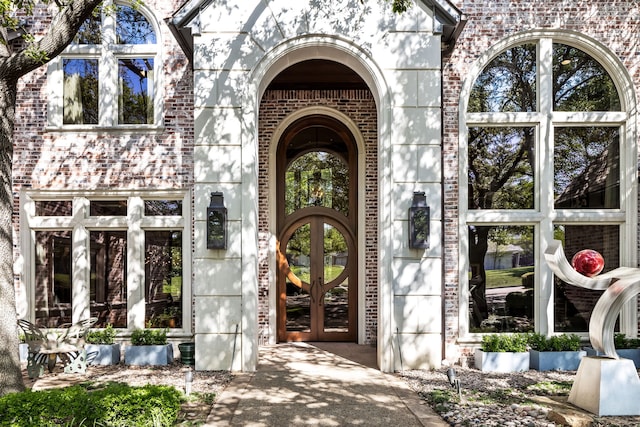 14516 Winnwood Rd, Addison, TX 75254 - entrance to property featuring french doors and brick siding