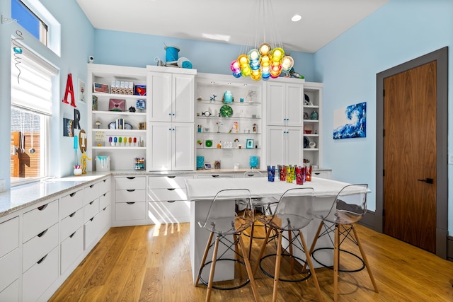 14516 Winnwood Rd, Addison, TX 75254 - kitchen featuring open shelves, light wood finished floors, and plenty of natural light