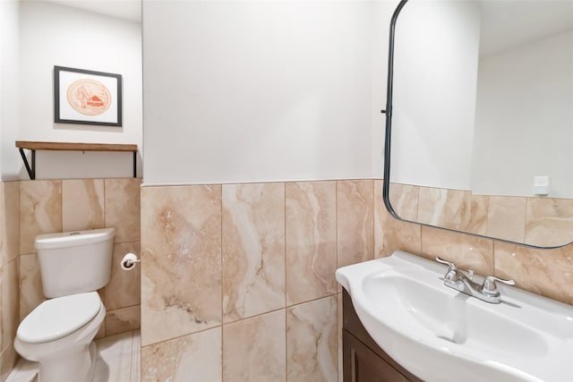 4912 Odessa Ave, Fort Worth, TX 76133 - half bathroom with tile walls, vanity, and a wainscoted wall