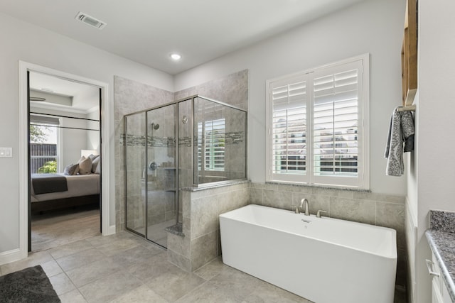 1300 Carlet Dr, Little Elm, TX 75068 - ensuite bathroom featuring a soaking tub, a shower stall, tile patterned flooring, and recessed lighting