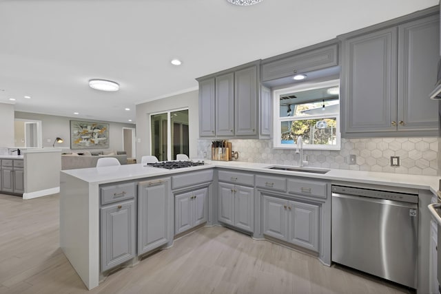6375 Lansdale Rd, Fort Worth, TX 76116 - kitchen featuring stainless steel dishwasher, gray cabinets, a peninsula, light wood-style flooring, and gas cooktop