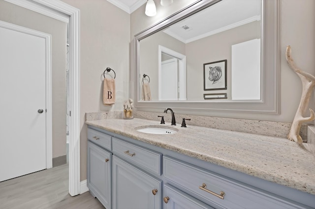 6375 Lansdale Rd, Fort Worth, TX 76116 - bathroom featuring vanity, crown molding, and wood finished floors