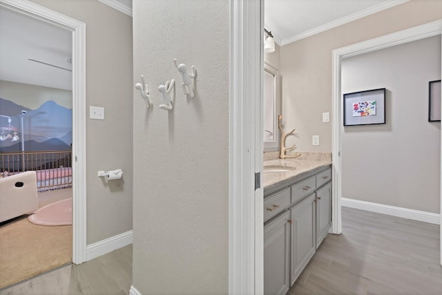 6375 Lansdale Rd, Fort Worth, TX 76116 - bathroom featuring ornamental molding, vanity, and wood finished floors
