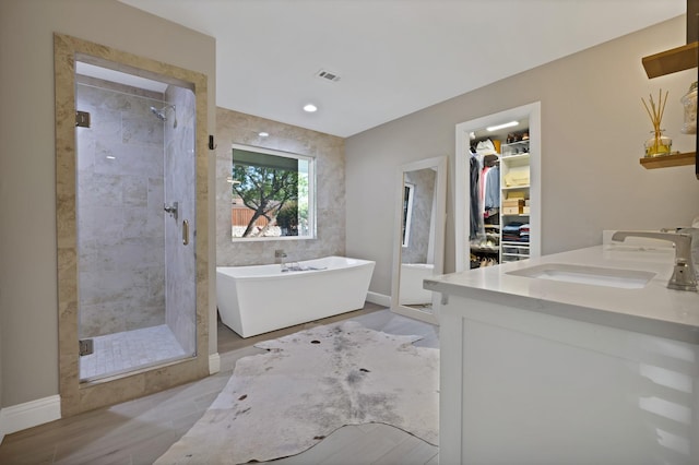 6375 Lansdale Rd, Fort Worth, TX 76116 - full bath featuring a freestanding bath, a stall shower, double vanity, and a spacious closet