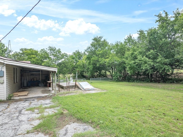 415 S Union St, Montague, TX 76251 - view of yard featuring view of wooded area and a carport