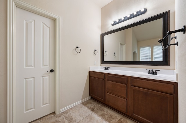 8225 Courtney Way, Watauga, TX 76148 - full bathroom with double vanity and baseboards