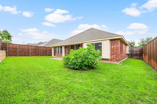 8225 Courtney Way, Watauga, TX 76148 - rear view of house with brick siding, a fenced backyard, and roof with shingles