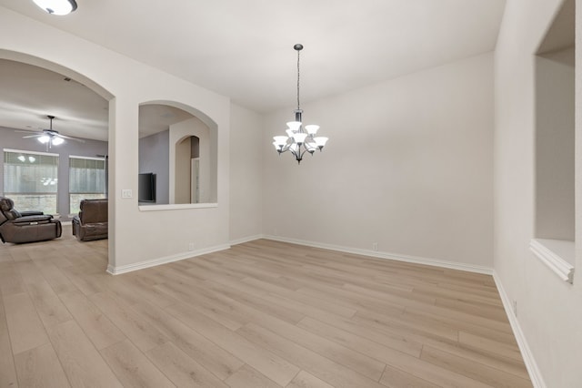 8225 Courtney Way, Watauga, TX 76148 - empty room featuring light wood finished floors, ceiling fan, and a chandelier