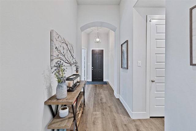1429 Arrowwood Dr, Aubrey, TX 76227 - entrance foyer with arched walkways and light wood-type flooring