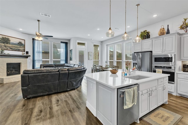 1429 Arrowwood Dr, Aubrey, TX 76227 - kitchen featuring stainless steel appliances, a ceiling fan, light countertops, plenty of natural light, and recessed lighting