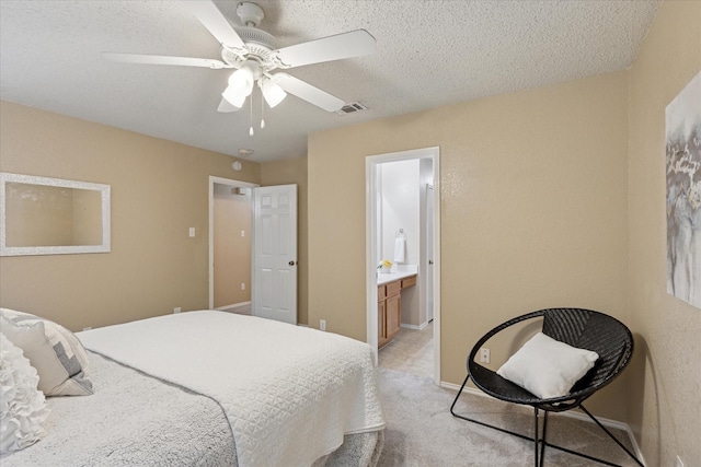 2611 Winding Rd, Fort Worth, TX 76133 - bedroom with light carpet, a ceiling fan, ensuite bathroom, and a textured ceiling