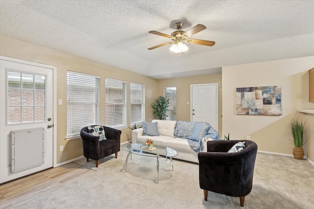 2611 Winding Rd, Fort Worth, TX 76133 - carpeted living room with ceiling fan, a textured ceiling, and a raised ceiling