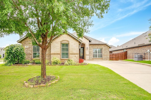 201 Saxon St, Waxahachie, TX 75165 - view of front of property with brick siding, driveway, and stone siding