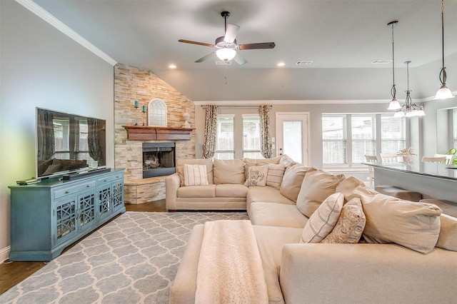 201 Saxon St, Waxahachie, TX 75165 - living area featuring a ceiling fan, wood finished floors, lofted ceiling, a fireplace, and ornamental molding