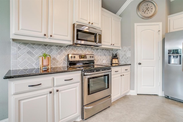 201 Saxon St, Waxahachie, TX 75165 - kitchen featuring appliances with stainless steel finishes, decorative backsplash, white cabinetry, dark stone countertops, and crown molding