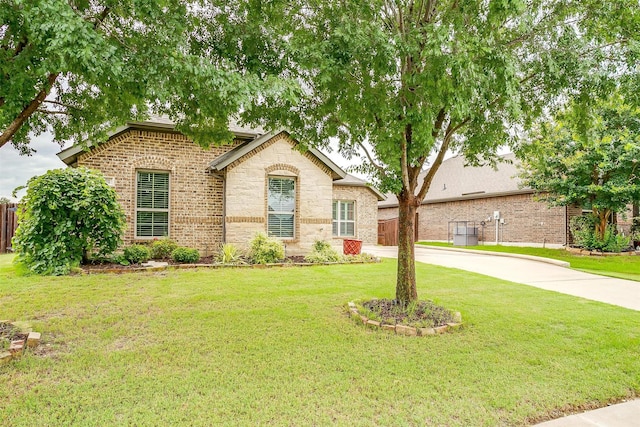 201 Saxon St, Waxahachie, TX 75165 - view of front of home with a front lawn and brick siding