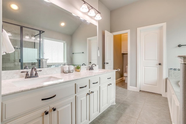 201 Saxon St, Waxahachie, TX 75165 - bathroom featuring double vanity, a stall shower, tile patterned flooring, a bathtub, and recessed lighting