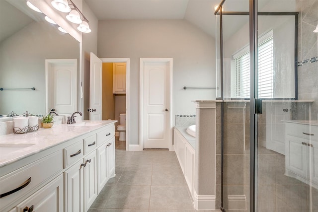 201 Saxon St, Waxahachie, TX 75165 - bathroom featuring a garden tub, double vanity, lofted ceiling, tile patterned floors, and a shower stall