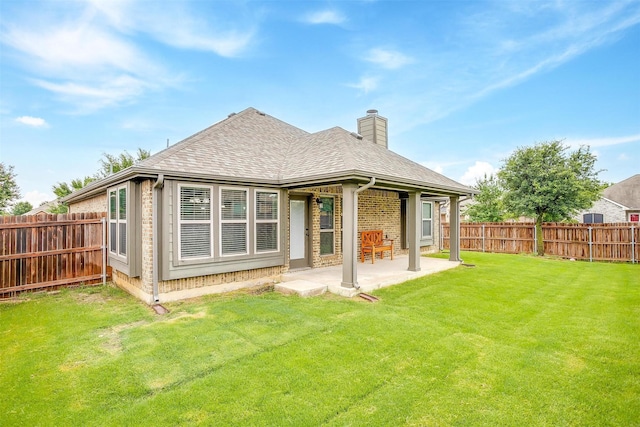 201 Saxon St, Waxahachie, TX 75165 - back of house featuring a chimney, a fenced backyard, a patio, and roof with shingles