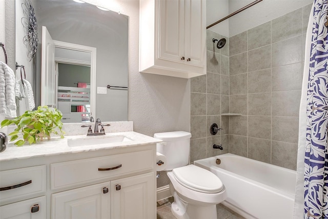 201 Saxon St, Waxahachie, TX 75165 - bathroom featuring vanity, shower / bath combo, and a textured wall