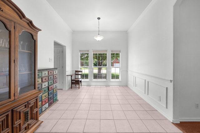 905 Austin Acre, Sulphur Springs, TX 75482 - dining area with wainscoting, light tile patterned flooring, and crown molding