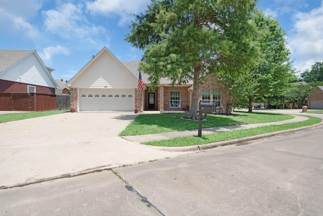 905 Austin Acre, Sulphur Springs, TX 75482 - view of front of property with driveway, an attached garage, and brick siding