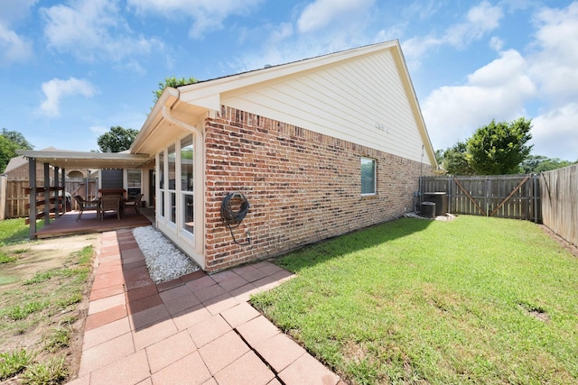 905 Austin Acre, Sulphur Springs, TX 75482 - view of property exterior featuring brick siding, a fenced backyard, a patio, and a wooden deck