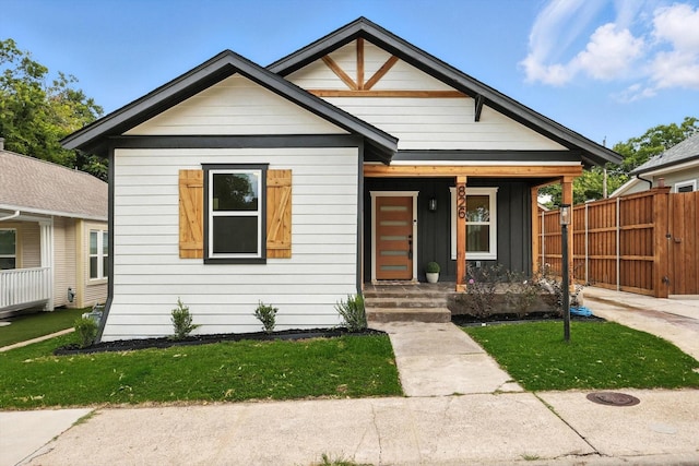 826 W Canty St, Dallas, TX 75208 - view of front of house with covered porch and board and batten siding