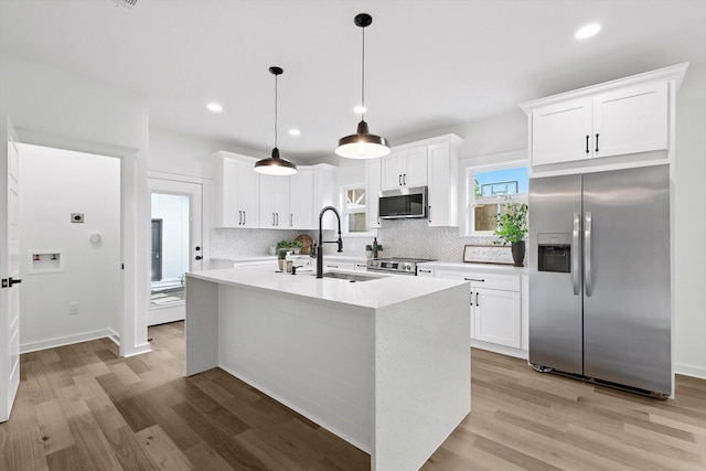 826 W Canty St, Dallas, TX 75208 - kitchen featuring stainless steel appliances, light wood-type flooring, light countertops, decorative backsplash, and recessed lighting