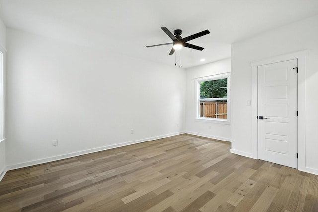 826 W Canty St, Dallas, TX 75208 - empty room featuring wood finished floors, ceiling fan, and recessed lighting