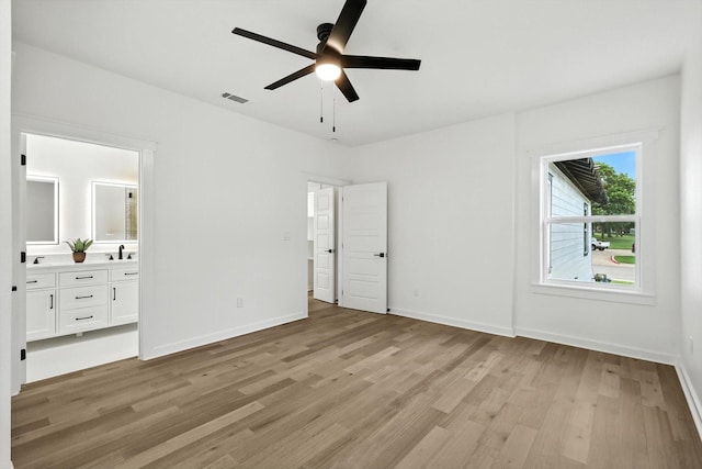 826 W Canty St, Dallas, TX 75208 - unfurnished bedroom featuring light wood-type flooring, ensuite bath, and ceiling fan