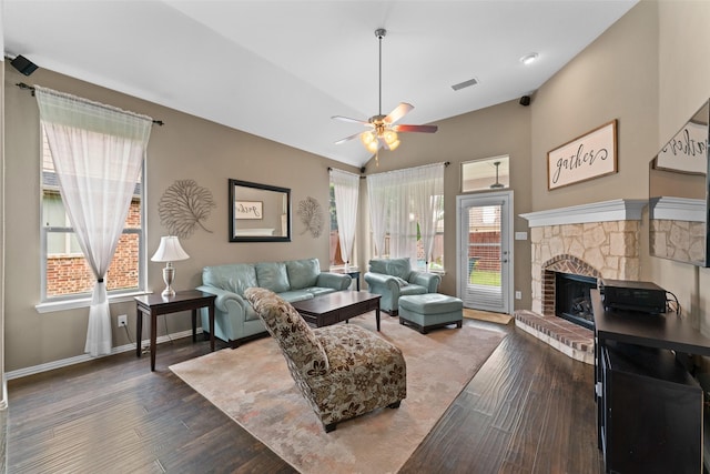 209 Willet Ct, Little Elm, TX 75068 - living area featuring dark wood finished floors, a ceiling fan, a fireplace, and vaulted ceiling
