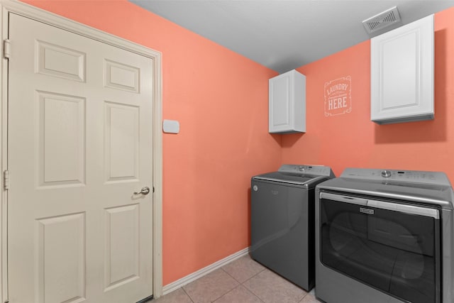 209 Willet Ct, Little Elm, TX 75068 - washroom with cabinet space, separate washer and dryer, and light tile patterned floors
