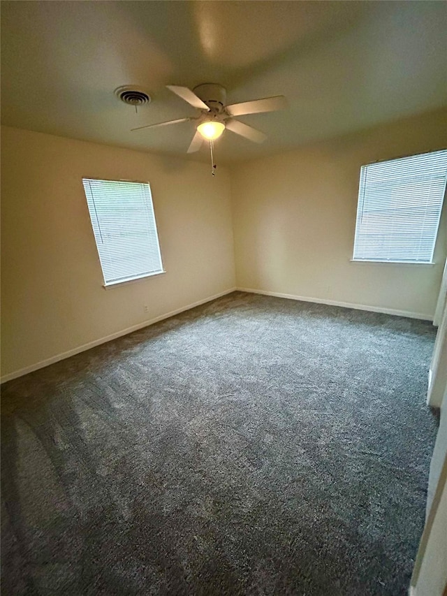 128 Robert St, Burleson, TX 76028 - spare room with dark carpet, plenty of natural light, and ceiling fan