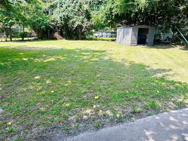128 Robert St, Burleson, TX 76028 - view of yard with a storage shed