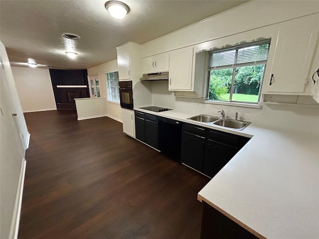 128 Robert St, Burleson, TX 76028 - kitchen featuring black appliances, dark wood finished floors, light countertops, and dark cabinetry