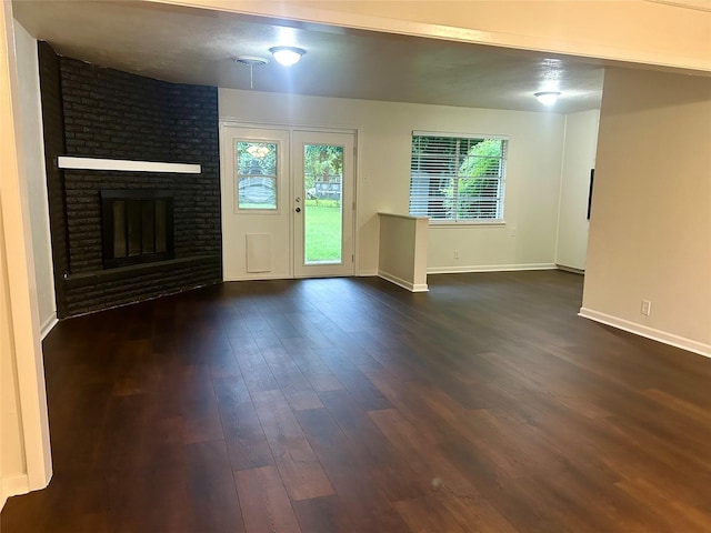 128 Robert St, Burleson, TX 76028 - unfurnished living room with dark wood-style flooring and a fireplace
